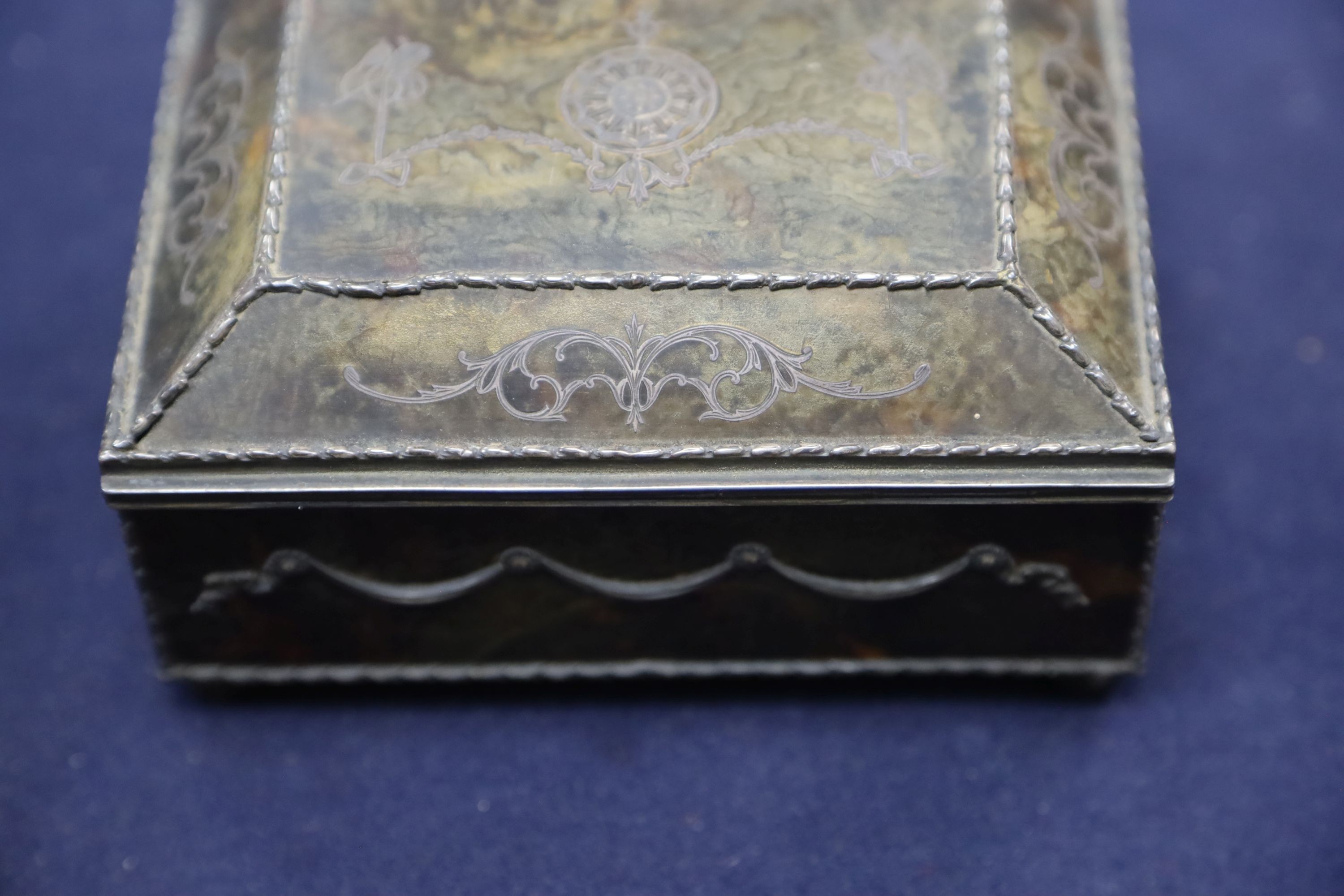 A silver-mounted tortoiseshell pique rectangular trinket box, by William Comyns, raised on four ball feet, London, 1904, width 15cm. 15cm